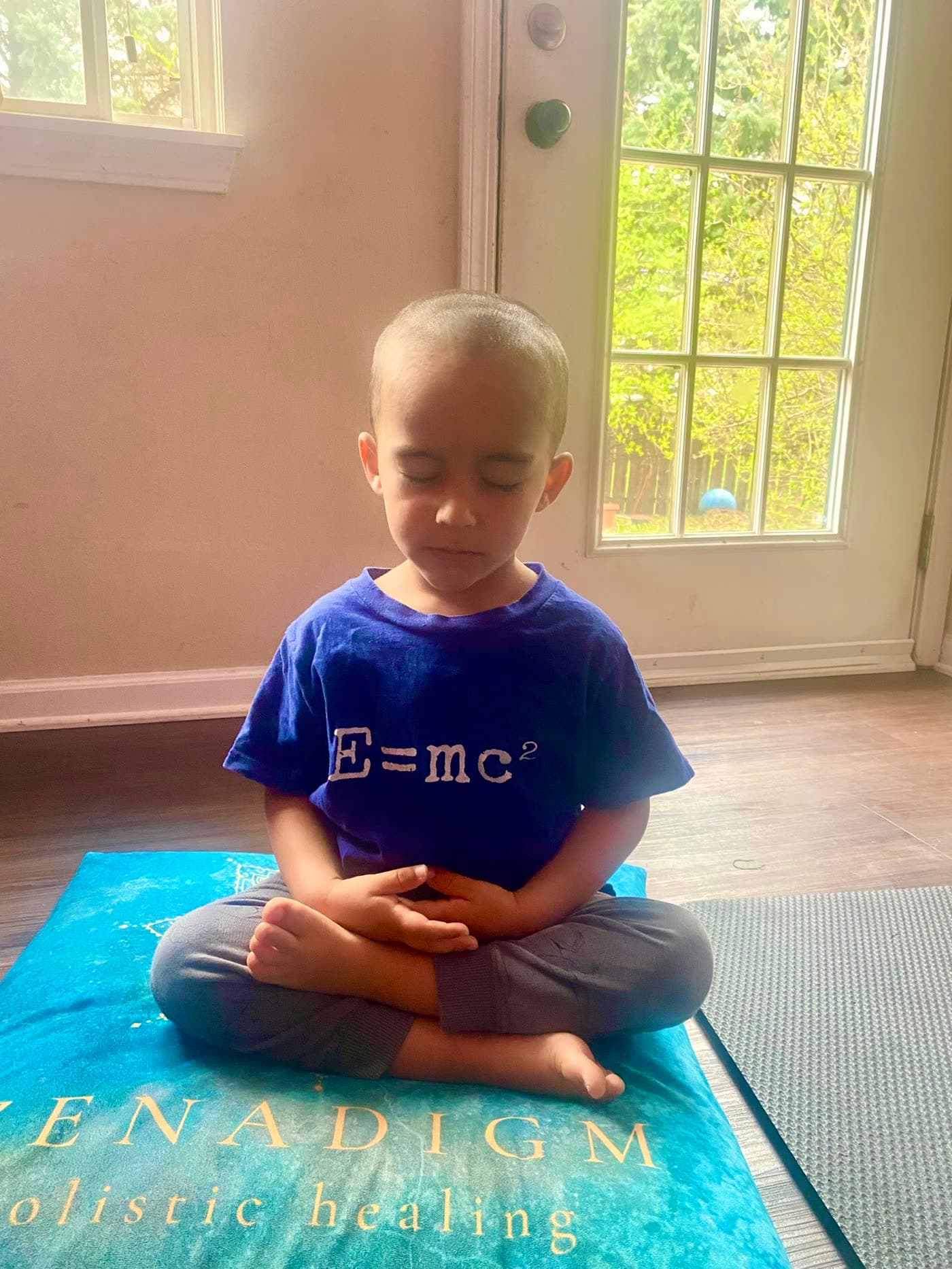 A young student in seated meditation
